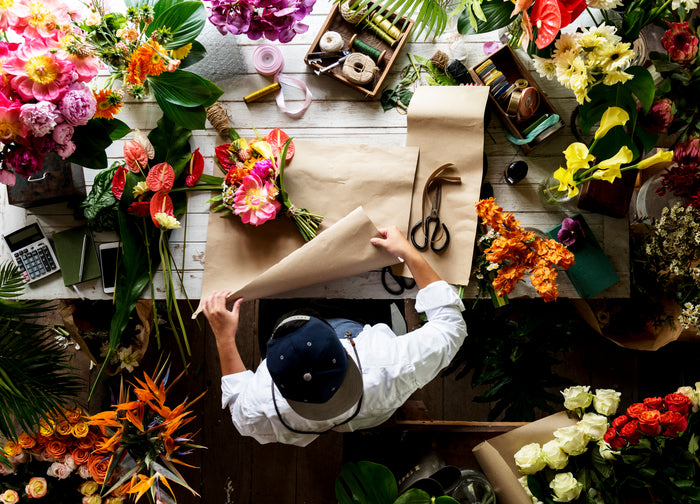 Flowers and tools on a floral design worktable